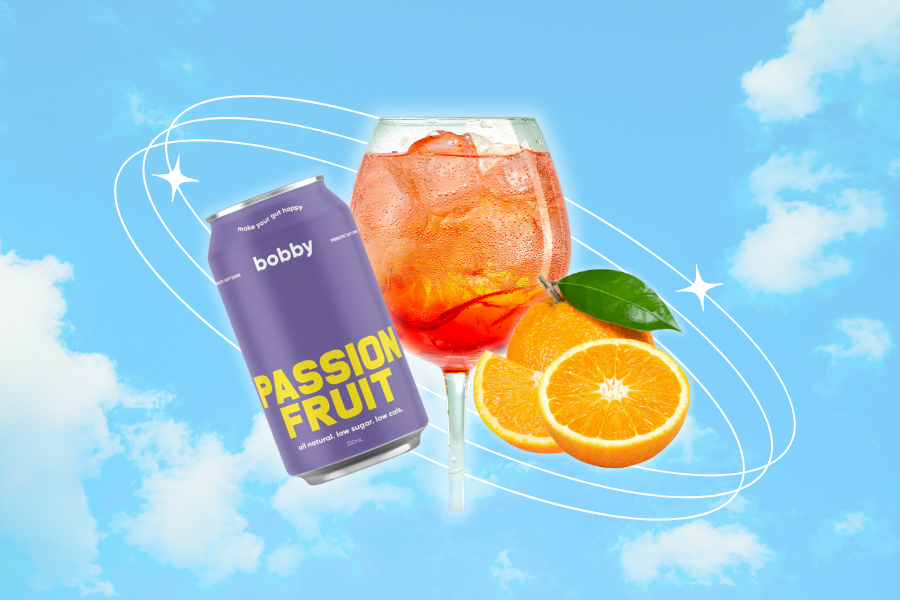 Coco Loco Aperol Spritz — Passionfruit hard seltzer with Aperol and orange garnish