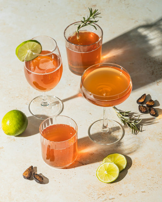 Passionfruit Hugo Spritz with orange liqueur and fresh rosemary. Photo by No Revisions on Unsplash