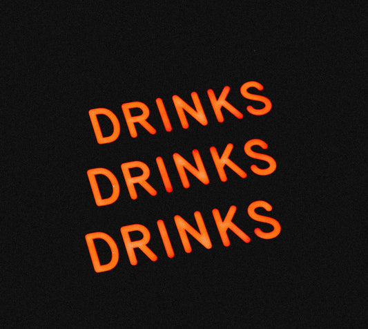 Neon light with 'Drinks' showing Buy alcohol online Australia