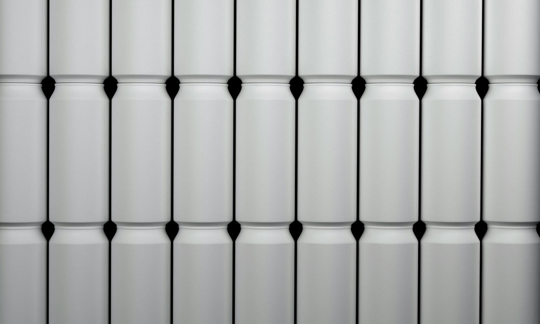 Stack of white Coco Loco drink cans
