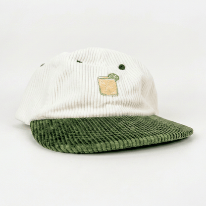 Coco Loco × Lies Collective Margarita cap — white corduroy with olive brim, side profile showing embroidered cocktail