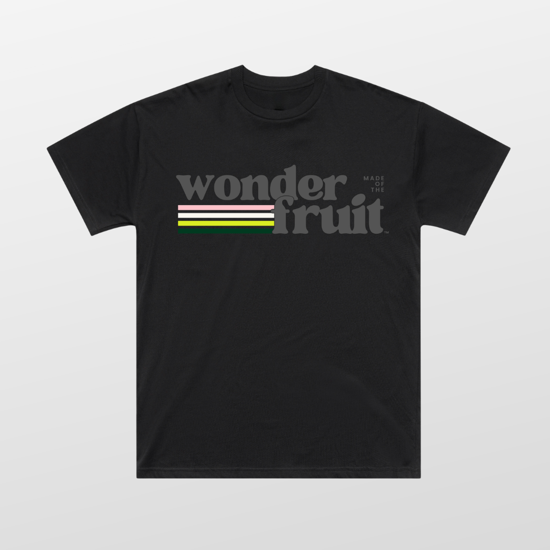 Vintage Vibes Oversized Tee front — retro Wonderfruit wordmark graphic with sunset palette on black AS Colour 5069