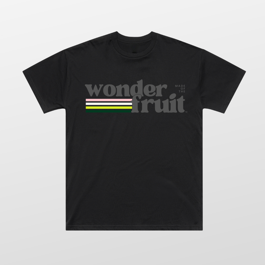 Vintage Vibes Oversized Tee front — retro Wonderfruit wordmark graphic with sunset palette on black AS Colour 5069