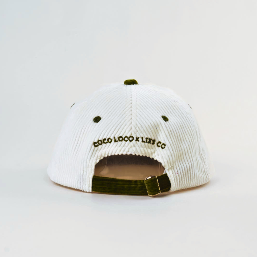 Coco Loco x Lies Collective Coconut Margarita cap — white corduroy dad cap with olive brim, back view showing adjustable strap