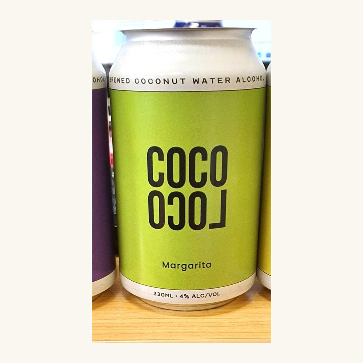 A green Coco Loco Margarita can, labelled brewed coconut water alcohol, 330mL and 4% alcohol by volume