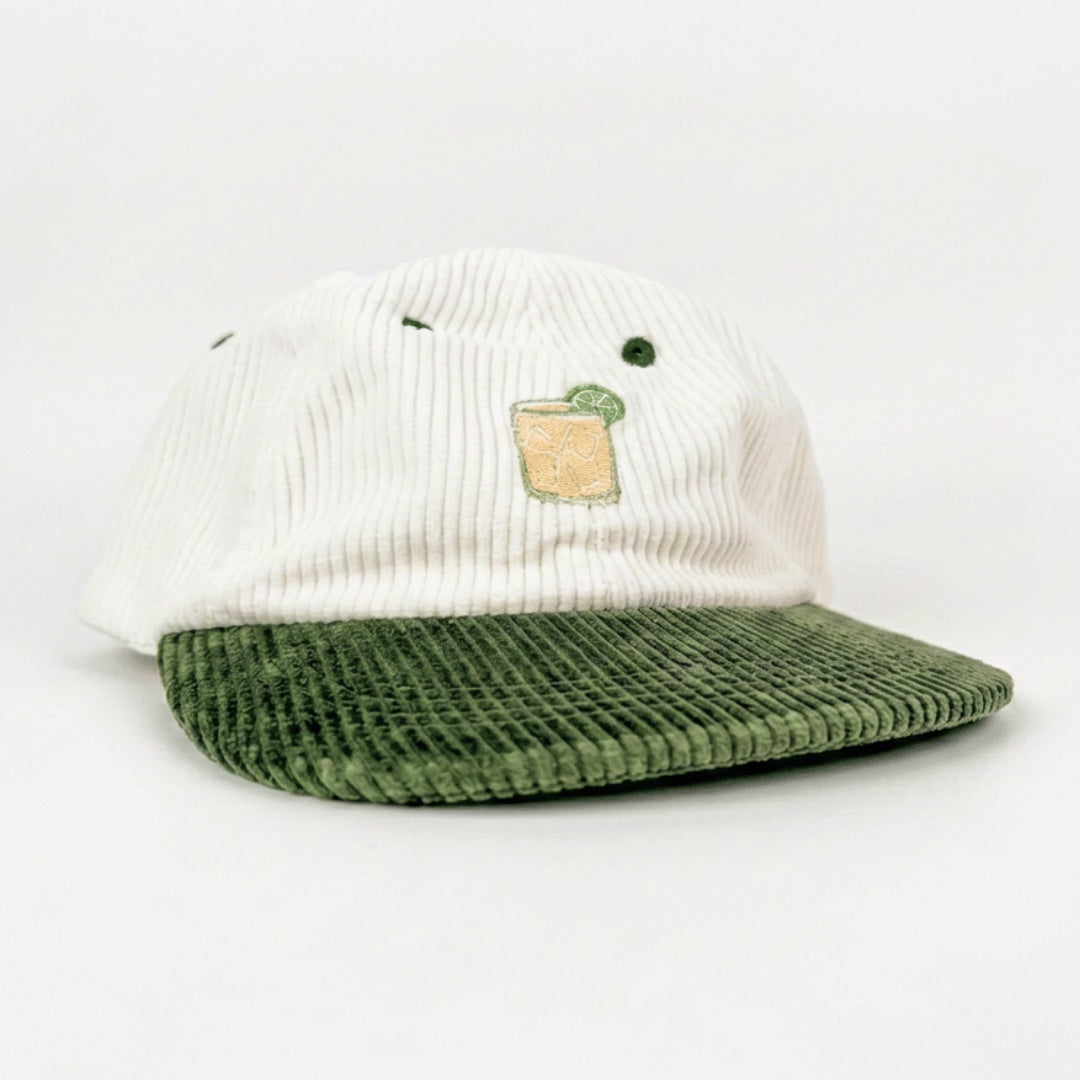 Margarita cap angled view showing the olive corduroy brim and white ribbed 6 panel crown